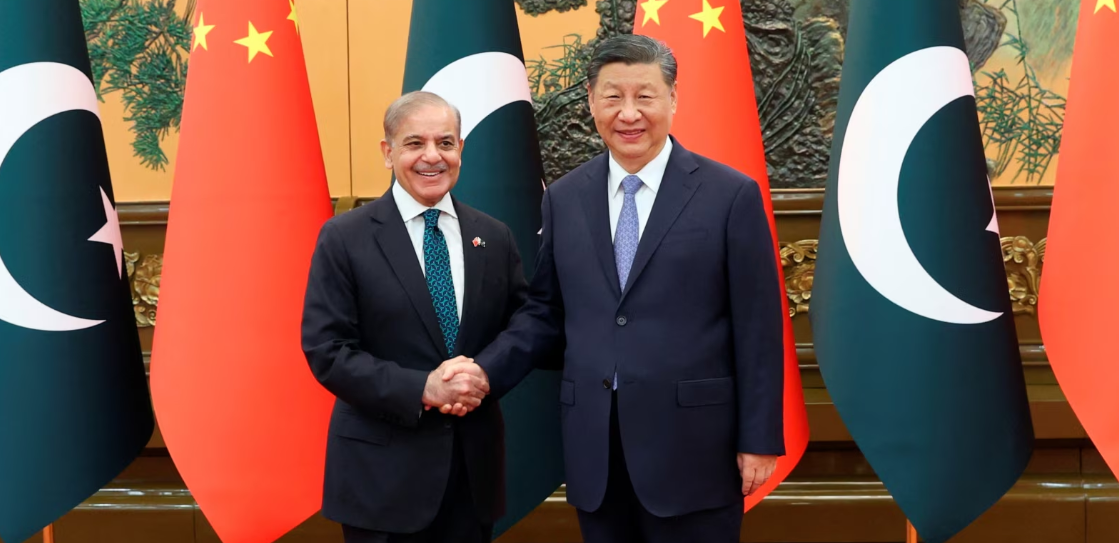 Chinese President Xi Jinping, right, and Pakistani Prime Minister Shehbaz Sharif shake hands at the Great Hall of the People in Beijing, China, June 7, 2024